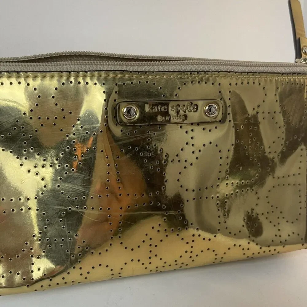 - KATE SPADE New York LITTLE SHILOH Metro Spade Gold Shimmer cosmetic bag